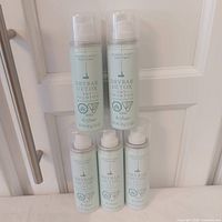 Five Drybar Detox Dry Shampoo cans grouped, labels visible