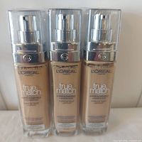 Front view of three sealed L'Oreal True Match foundations in shade 4.5W