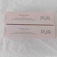 Two boxed PUR On Point Tint products front view