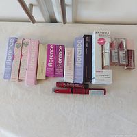 All boxed lip products lined up, front view