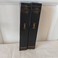 Front view of two boxed YSL Lash Clash mascaras