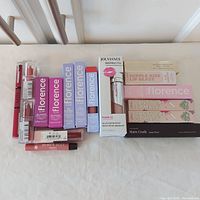 All 17 boxed and unboxed lip products laid out side by side