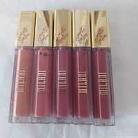Front view of all five lip creams showing colors and branding