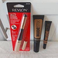 All three items: Revlon blender in package, Nudestix foundation tube, Nudestix concealer tube