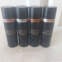 Front view of all four Nudestix Nudies Glow sticks showing shade labels
