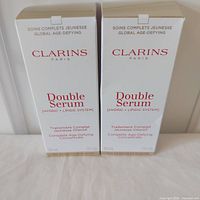 Front view of two sealed Clarins Double Serum boxes 30 mL