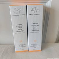 Front view of two sealed Drunk Elephant C-Luma Hydrabright Serum boxes