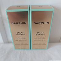 Front view of two Darphin Éclat Sublime 30 ml serum boxes