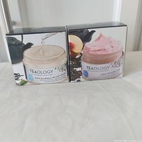 Front view of two sealed Teaology cream boxes