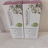Front view of two sealed Teaology Niacinamide Infusion Serum boxes