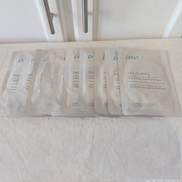 Ten PMD Recovery sheet mask pouches arranged flat