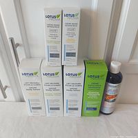 Front view showing six boxed Lotus Aroma products