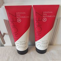 Front view of two St. Tropez Gradual Tan Watermelon Lotion tubes