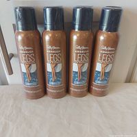 Four sealed cans front view