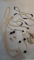 All necklaces and earrings laid out