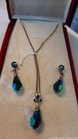 Necklace and earrings displayed in case