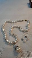 Necklace strand, pendant and earrings overview