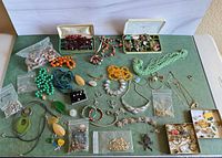 overview of entire mixed jewelry lot laid out on table