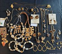Full layout of assorted necklaces, bracelets, earrings and brooches