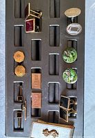 Tray showing all cufflinks and tie bar