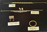 Group overview showing all five jewelry items with brand labels