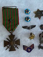 Group showing medal, badges and pins on white background