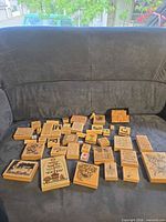 Group view of all wooden rubber stamps spread on sofa