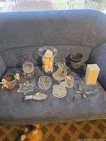 Overview of all candle holders and decor on sofa