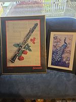 Both framed artworks side by side on sofa
