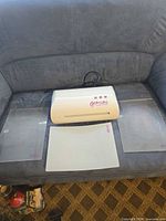 Front view of Gemini machine with two clear plates and white shim