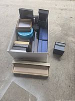 Top view showing full assortment of boxes in and beside larger container