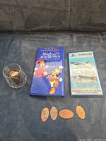 All items overview: two albums, glass with pennies, four loose pennies