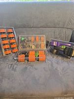 Overview of three plastic cases containing wheels and handles