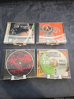 Four PC game jewel cases front view