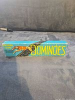 Front view of boxed Greyhound Brand Dominoes set