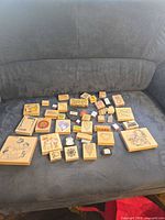 Overall lot of rubber stamps on sofa