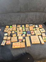 All 53 wood block stamps laid out on sofa
