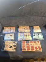 All seven clamshell cases with wood block stamps displayed