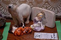 Photo showing B & G polar bear ceramic figurine, two Royal Doulton small dog figurines, Mary Had a Little Lamb figurine, and a soapstone sculpture flat carved piece.