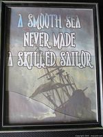 Full view of framed wall art showing quote and ship illustration
