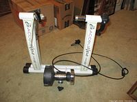 Full view of AccelaVelo Mag-XA trainer with skewer and cable