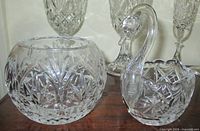 Rose bowl and swan bowl together showing cut patterns
