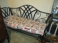 Front view of black steel bench with cushion in place