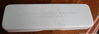 Embossed white plastic case closed