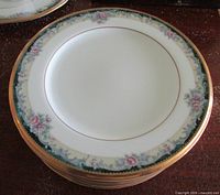 Stack of Noritake Miamor plates showing full design and gold rim
