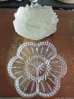 Both dishes: clear lobed divided dish and silvered wavy bowl