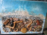 Front view showing entire seascape artwork with embedded natural materials
