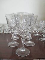 Front view of etched red wine glasses showing pattern and form