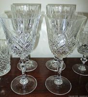 Six cut crystal goblets shown for pattern and shape detail