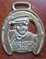 Front view of Jamaica Inn horse brass showing full design and size reference